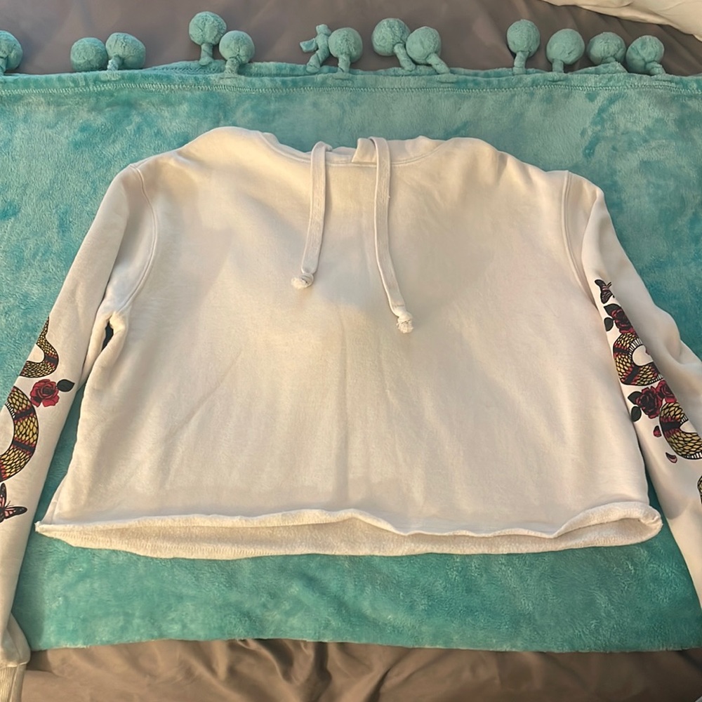 Cotton On ehite cropped hoodie with snake pattern on sleeves
